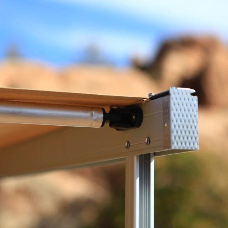 eezi-awn-swift-awning-beige-open-right-corner-view-close-up-aluminum-arm-and-twist-lock-arm