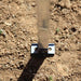 eezi-awn-swift-awning-open-aluminum-leg-anchor-plate-close-up-view-on-ground