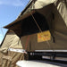 eezi-awn-xklusiv-soft-shell-roof-top-tent-beige-open-closed-up-view-on-vehicle-with-mesh-screen-window-in-nature
