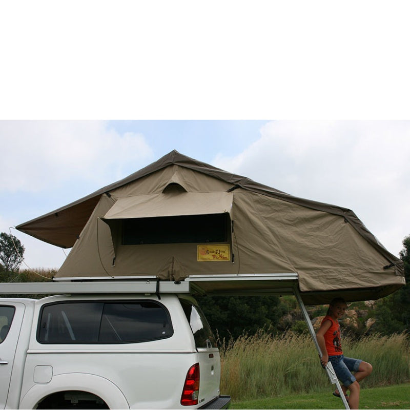 eezi-awn-xklusiv-soft-shell-roof-top-tent-beige-open-side-view-on-vehicle-with-person-and-extended-ladder-in-nature
