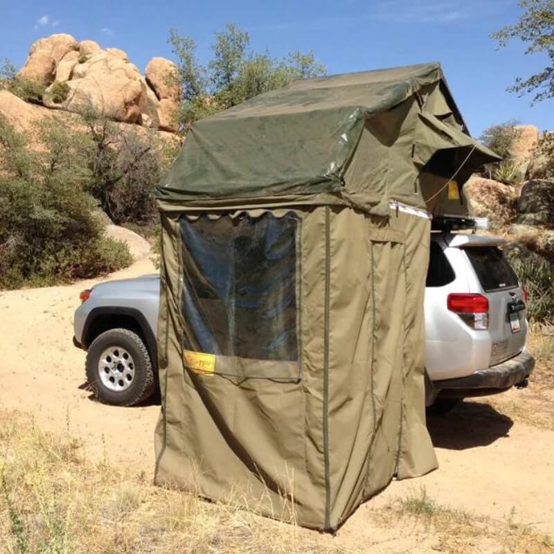 eezi-awn-xklusiv-soft-shell-roof-top-tent-olive-open-side-view-on-vehicle-with-window-in-desert