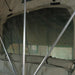 eezi-awn-xklusiv-soft-shell-roof-top-tent-open-interior-view-with-poles-and-mesh-window