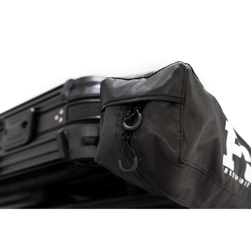 freespirit-recreation-270-awning-v2-closed-profile-view-of-storage-bag-on-toyota-tacoma-on-white-background