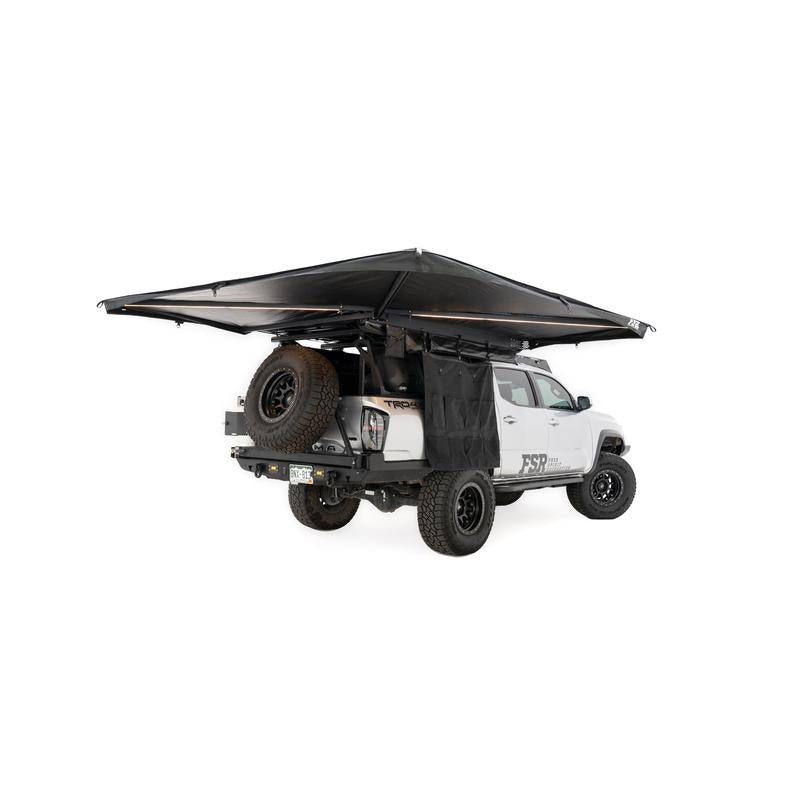 freespirit-recreation-270-awning-v2-open-rear-corner-view-with-awning-organizer-on-toyota-tacoma-on-white-background