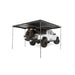 freespirit-recreation-270-awning-v2-open-rear-corner-view-with-poles-deployed-on-toyota-tacoma-on-white-background