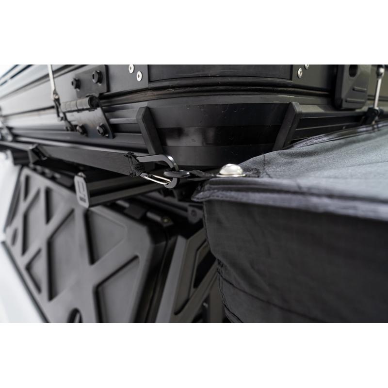 freespirit-recreation-270-awning-v2-side-view-of-tightening-strap-hook-on-toyota-tacoma