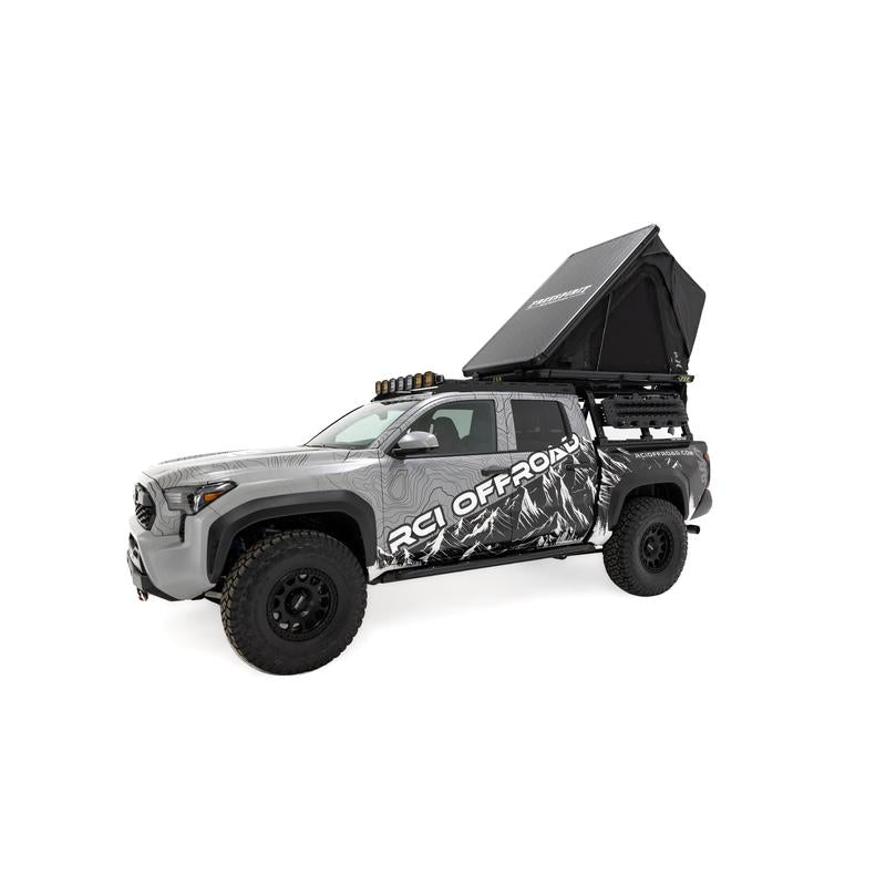 freespirit-recreation-aspen-v2-standard-hard-shell-roof-top-tent-black-open-front-corner-view-on-toyota-tacoma-on-white-backgroud
