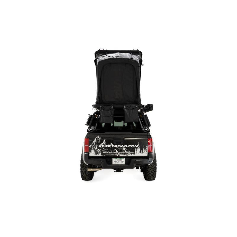 freespirit-recreation-aspen-v2-standard-hard-shell-roof-top-tent-black-open-rear-view-on-toyota-tacoma-on-white-backgroud