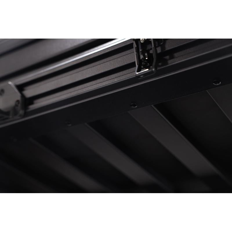 freespirit-recreation-evolution-v2-standard-hard-shell-roof-top-tent-black-close-up-view-of-floor-construction-on-white-background