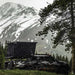 freespirit-recreation-evolution-v2-standard-hard-shell-roof-top-tent-black-open-rear-corner-view-on-truck-in-mountains-with-snow