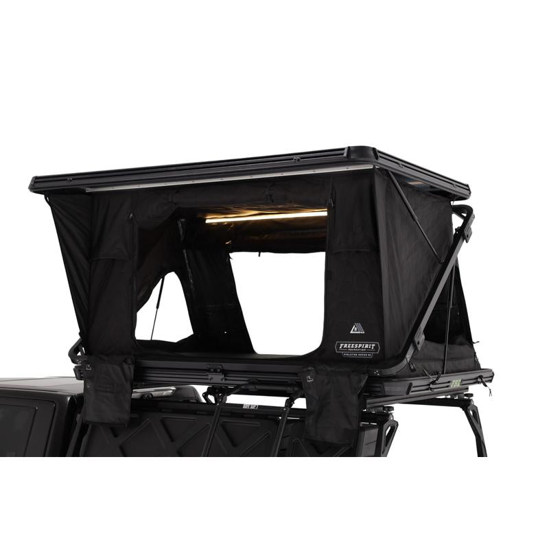 freespirit-recreation-evolution-v2-standard-hard-shell-roof-top-tent-black-open-side-corner-close-up-view-on-toyota-tundra-on-white-background