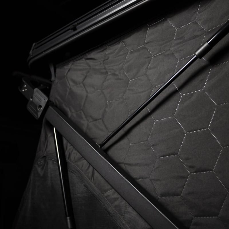 freespirit-recreation-evolution-v2-standard-hard-shell-roof-top-tent-black-open-tri-layer-fabric-and-gas-struts-view-on-black-background