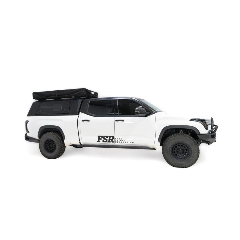 freespirit-recreation-high-country-v2-king-soft-shell-roof-top-tent-black-closed-side-view-on-toyota-tundra-on-white-background