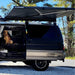 kammok-crosswing-awning-charcoal-5ft-open-front-view-on-van-in-nature