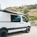 kammok-crosswing-awning-charcoal-7ft-open-rear-corner-view-on-van-in-nature
