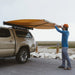 kammok-crosswing-awning-tan-7ft-open-front-corner-view-on-truck-in-nature