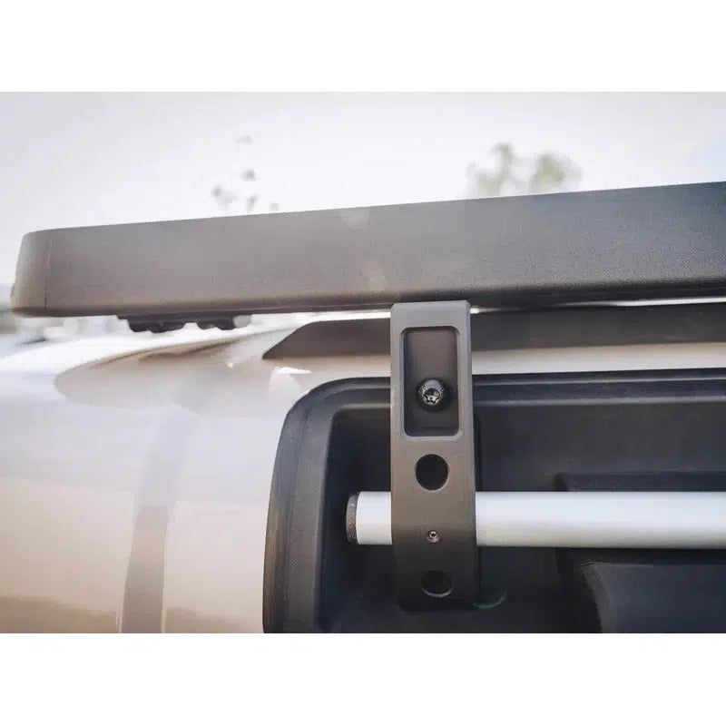 leitner-acs-roof-3-4-platform-rack-for-ineos-grenadier-2024-close-up-view-with-mounting-bracket-in-nature
