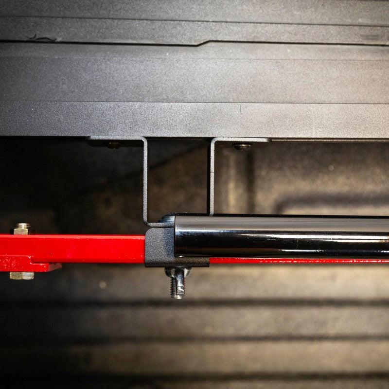 leitner-hi-lift-jack-bracket-close-up-view-with-red-hi-lift-jack-on-truck-bed
