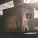 national-luna-legacy-smart-qc-fridge-and-freezer-front-corner-view-with-base-mounting-plate-inside-vehicle-in-nature
