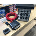 national-luna-nldc-25-and-auxiliary-battery-box-bundle-with-monitor-on-table