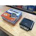 national-luna-nldc-25-dc-dc-25-amp-charger-front-corner-view-with-cardboard-packaging-on-table-top