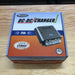 national-luna-nldc-25-dc-dc-25-amp-charger-inside-cardboard-packaging-on-table-top
