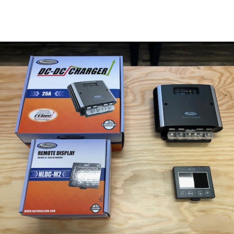 national-luna-nldc-25-dc-dc-25-amp-charger-top-view-with-lcd-monitor-and-cardboard-packaging-on-top-of-table