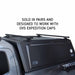 overland-vehicle-systems-expedition-truck-cap-crossbars-front-corner-view-on-truck-cap-on-white-background