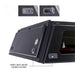 overland-vehicle-systems-expedition-truck-cap-for-chevrolet-silverado-1500-black-close-rear-corner-view-with-heavy-duty-latches-on-white-background
