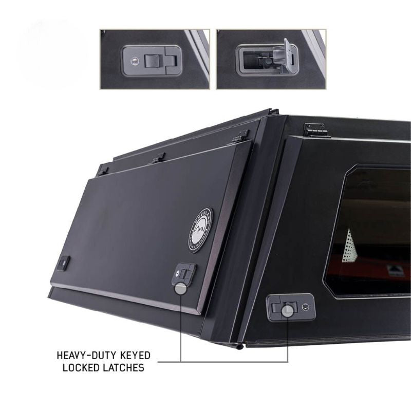 overland-vehicle-systems-expedition-truck-cap-for-chevrolet-silverado-1500-black-close-rear-corner-view-with-heavy-duty-latches-on-white-background