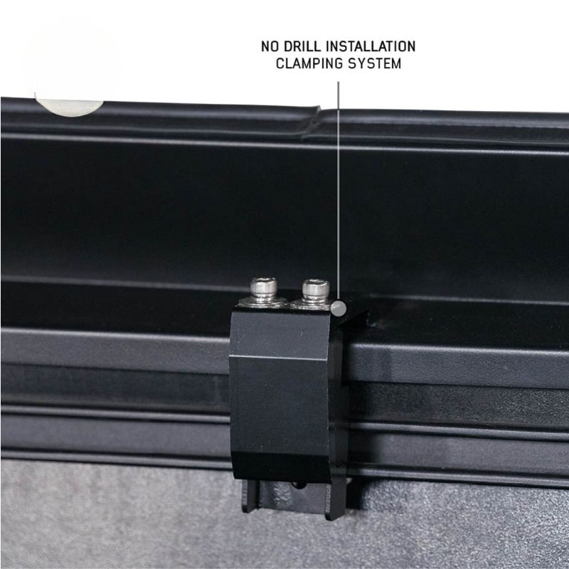 overland-vehicle-systems-expedition-truck-cap-for-jeep-gladiator-black-close-up-view-clamping-system-on-white-background