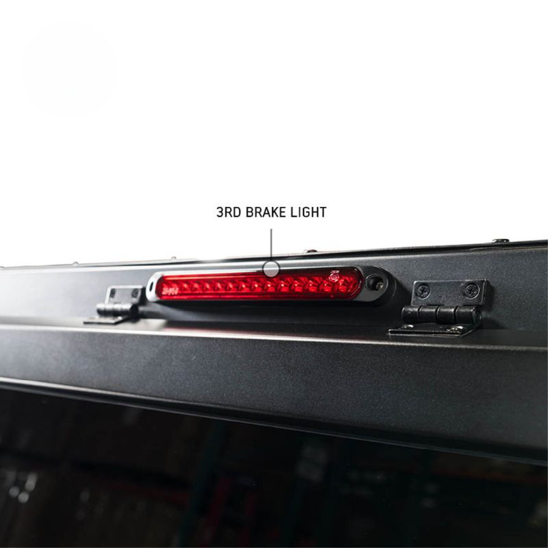 overland-vehicle-systems-expedition-truck-cap-for-ram-1500-black-closed-close-up-view-break-light-on-white-background