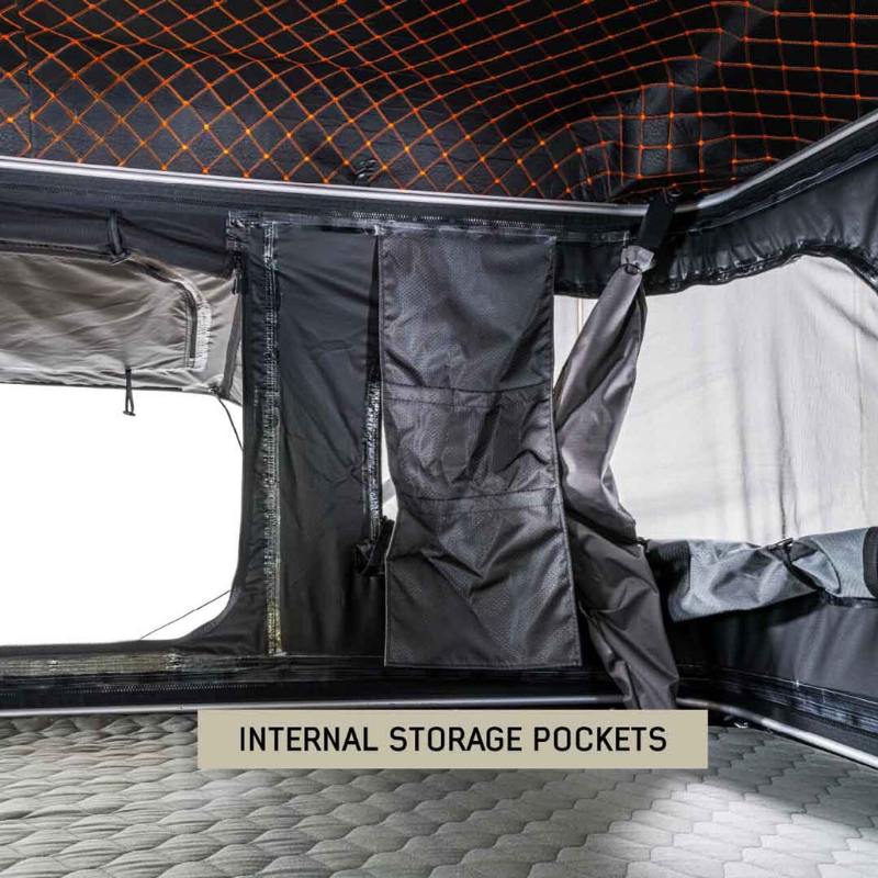 overland-vehicle-systems-hd-bundu-hard-shell-pop-up-roof-top-tent-gray-body-green-rainfly-open-interior-view-with-internal-storage-pockets
