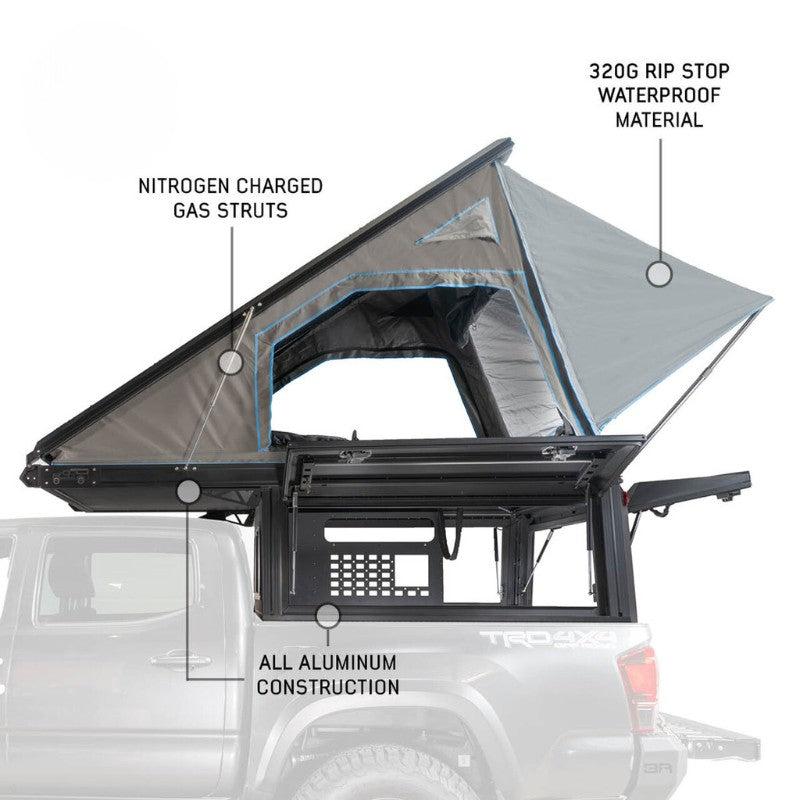 overland-vehicle-systems-magpak-camper-shell-roof-top-tent-for-toyota-tacoma-open-side-view-on-vehicle-gas-struts-on-white-background
