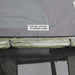 overland-vehicle-systems-nomadic-annex-fitted-to-nomadic-extended-soft-shell-roof-top-tent-gray-tent-green-annex-open-close-up-view-roll-up-windows