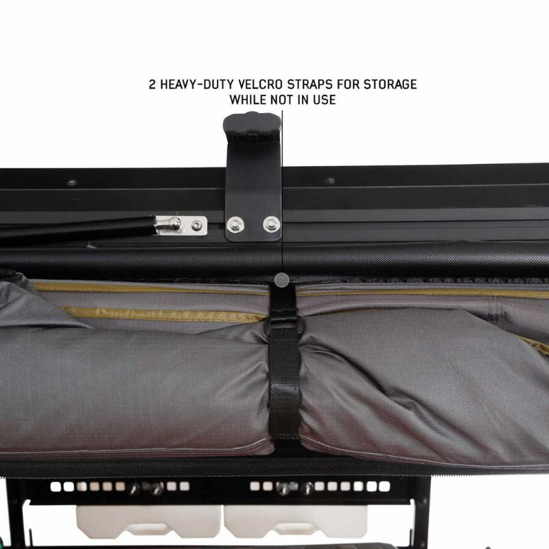 overland-vehicle-systems-nomadic-awning-180-lte-gray-closed-close-up-view-with-velcro-strap-on-white-background