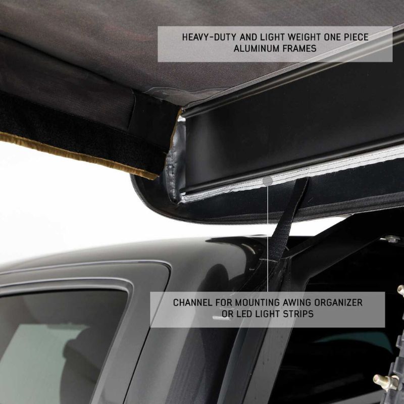 overland-vehicle-systems-nomadic-awning-180-lte-gray-open-close-up-view-on-vehicle-with-aluminum-frames