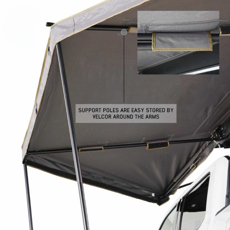 overland-vehicle-systems-nomadic-awning-180-lte-gray-open-interior-view-on-vehicle-with-support-poles-on-white-background