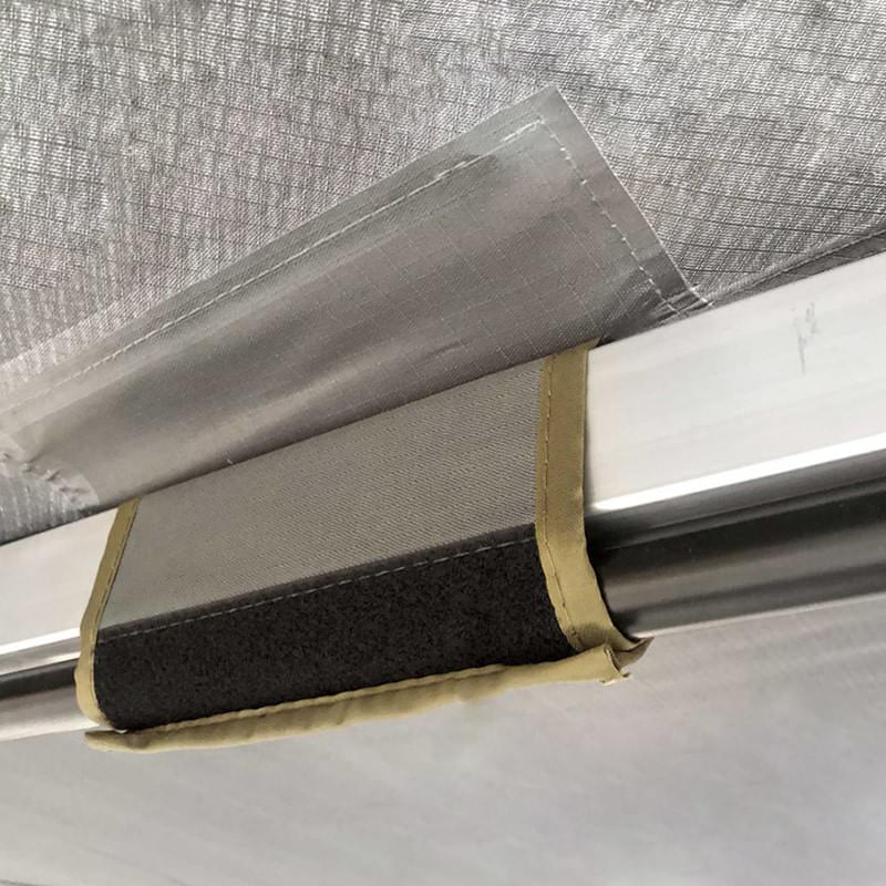 overland-vehicle-systems-nomadic-awning-180-with-zip-in-wall-gray-open-close-up-view-of-support-pole-velcro-fitting
