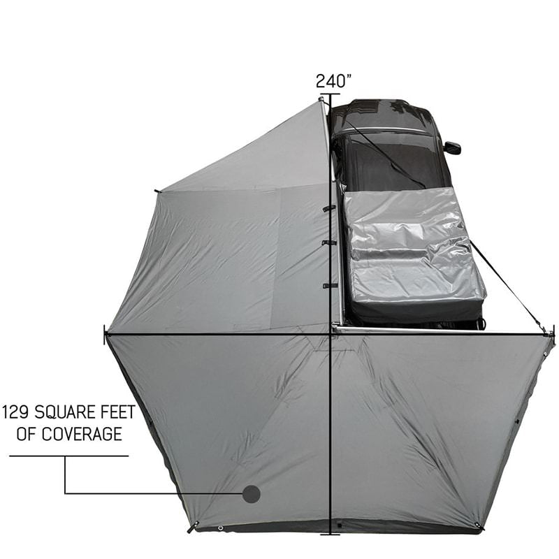 overland-vehicle-systems-nomadic-awning-270-for-mid-high-roofline-vans-driver-side-open-drone-view-on-toyota-tacoma-with-coverage-description