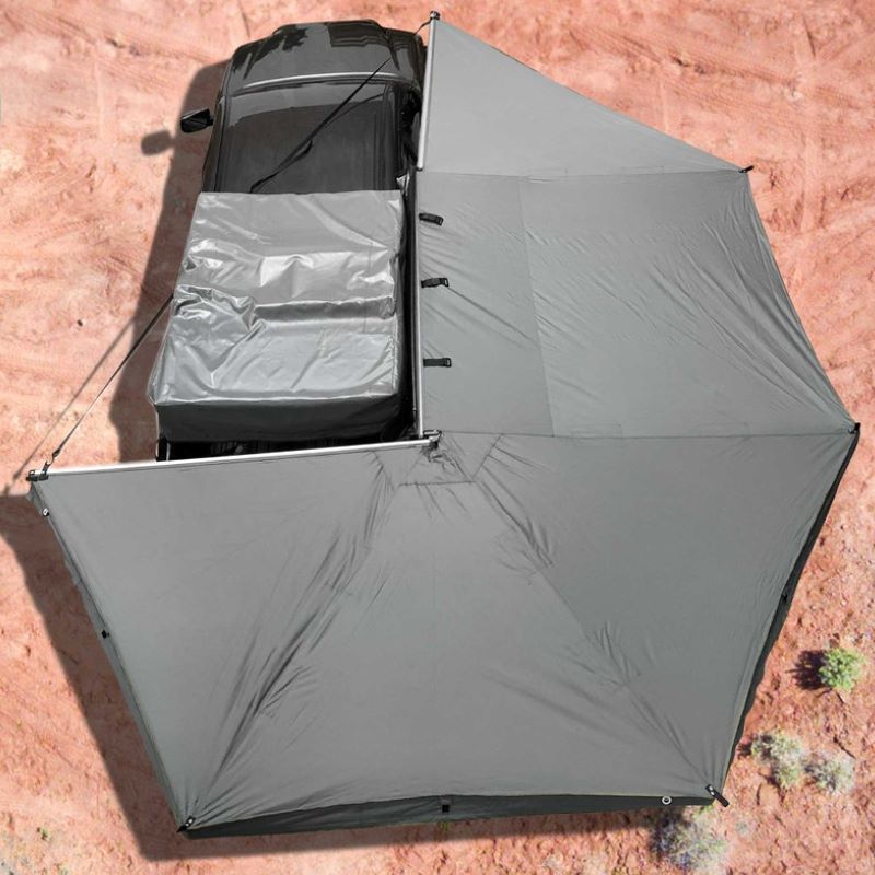 overland-vehicle-systems-nomadic-awning-270-passenger-side-gray-open-top-view-on-toyota-tacoma-in-desert