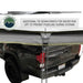 overland-vehicle-systems-nomadic-awning-270-passenger-side-gray-open-with-tie-down-points-description-on-toyota-tacoma