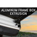 overland-vehicle-systems-nomadic-awning-4.5-ft-gray-open-close-up-view-with-aluminum-frame-in-nature