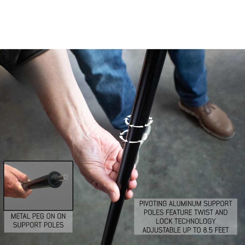 overland-vehicle-systems-nomadic-awning-4.5-ft-gray-open-close-up-view-with-hand-holding-twist-lock-pole