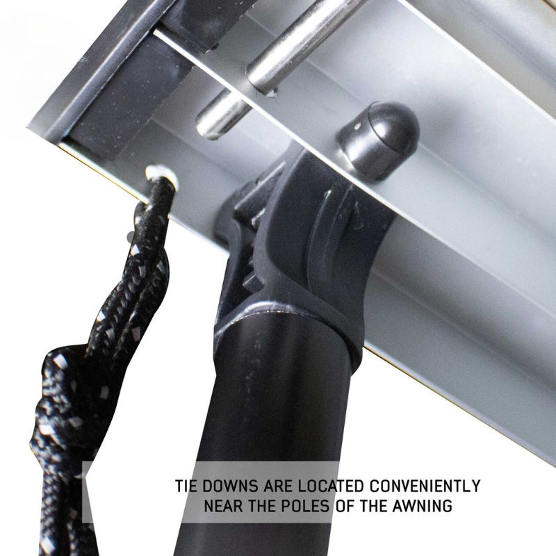 overland-vehicle-systems-nomadic-awning-4.5-ft-gray-open-close-up-view-with-tie-downs-on-white-background