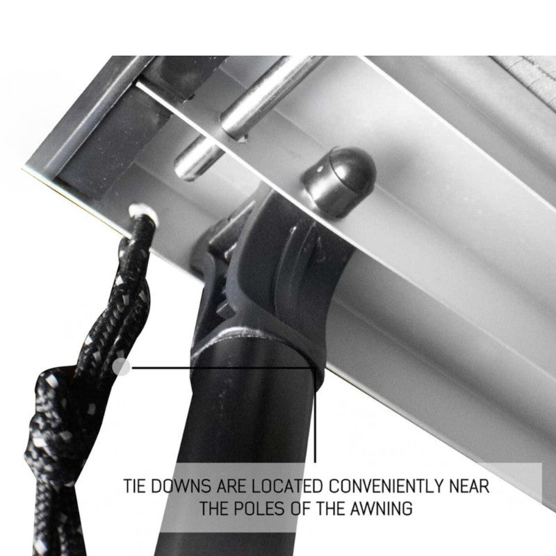 overland-vehicle-systems-nomadic-awning-6.5-ft-gray-open-close-up-view-with-tie-downs-on-white-background