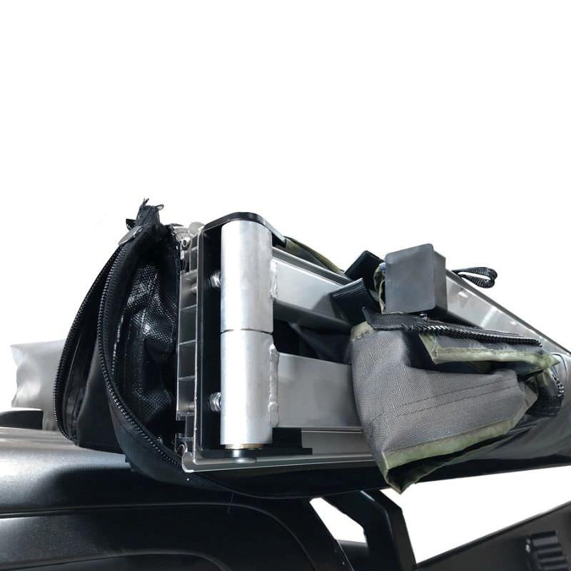 overland-vehicle-systems-nomadic-lt-270-awning-with-walls-dark-gray-closed-zoomed-in-view-of-heavy-duty-hinge-on-white-background