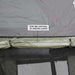overland-vehicle-systems-nomadic-roof-top-tent-annex-green-base-black-floor-open-close-up-view-hook-and-loop-roll-up-window-covers