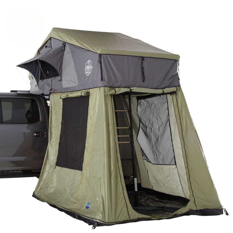 overland-vehicle-systems-nomadic-roof-top-tent-annex-green-base-black-floor-open-front-corner-view-on-vehicle-on-white-background