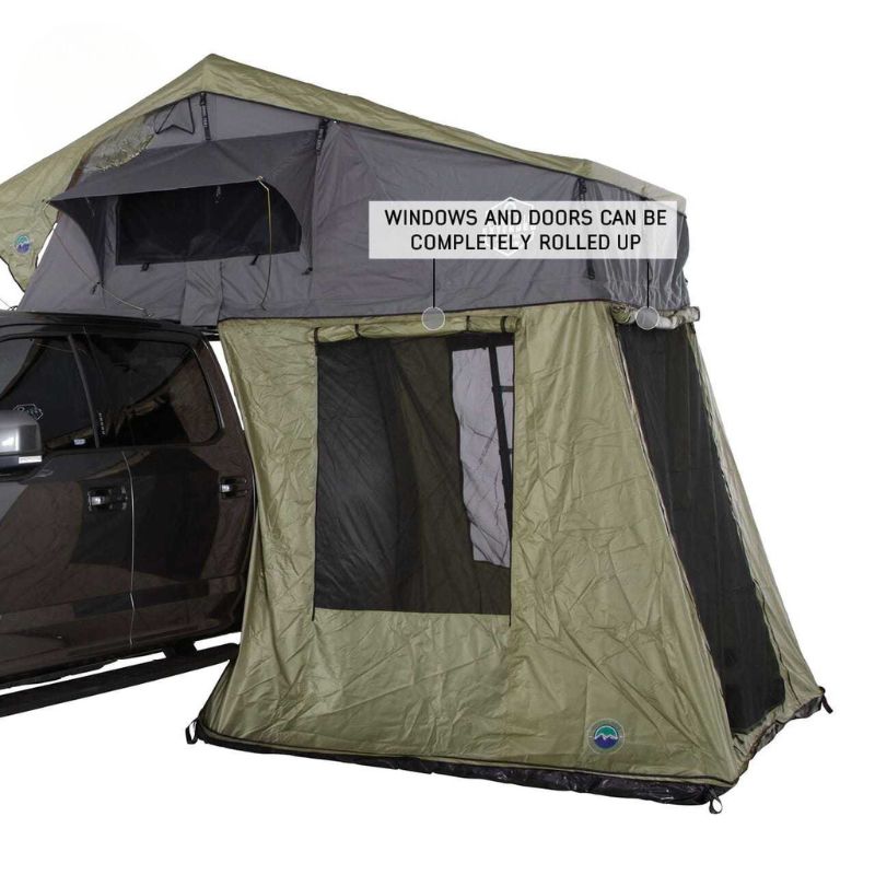 overland-vehicle-systems-nomadic-roof-top-tent-annex-green-base-black-floor-open-front-corner-view-roll-up-door-and-window-on-white-background
